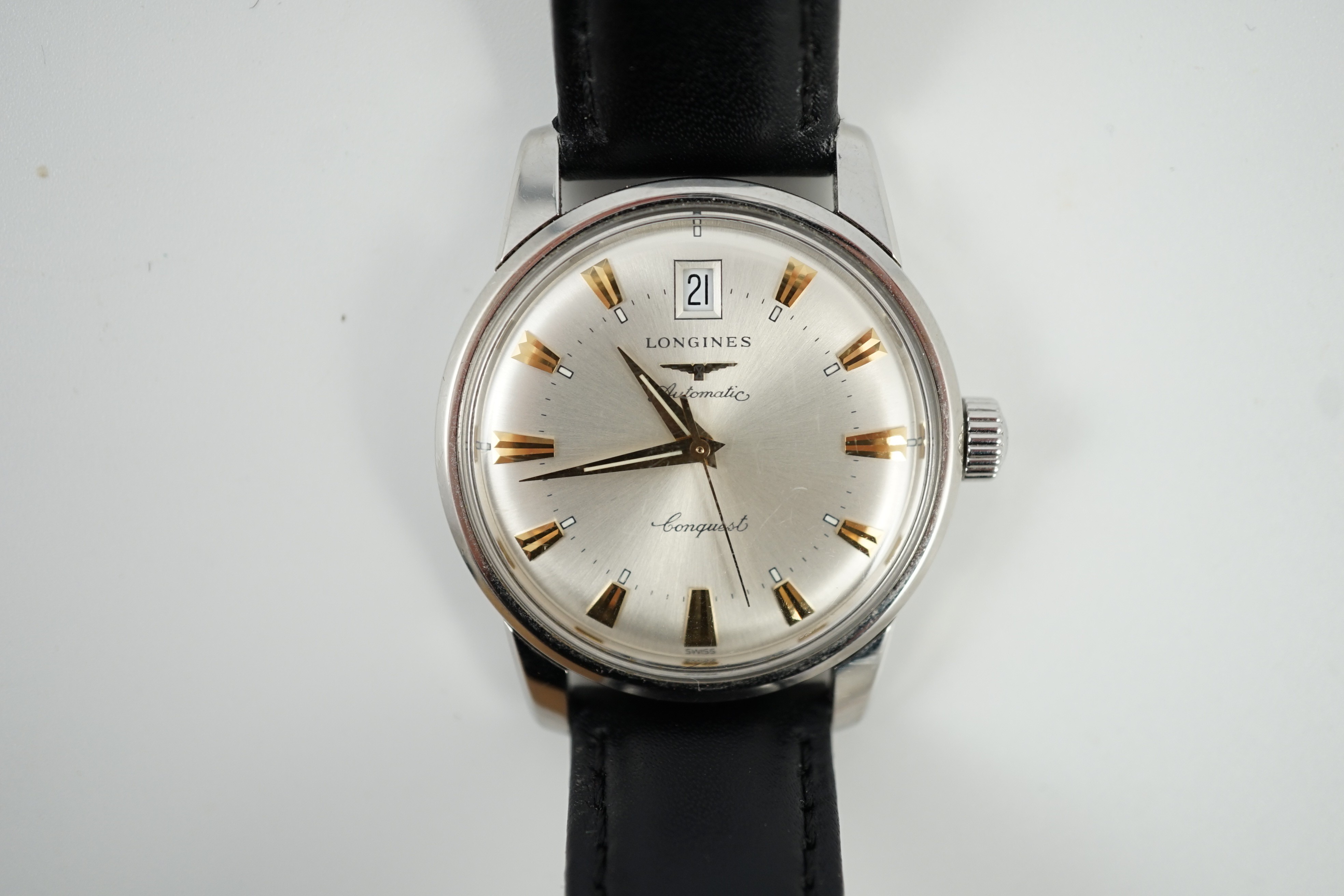A gentleman's steel and enamel Longines Conquest Automatic wrist watch, with date aperture, case diameter 36mm, on a later associated leather strap.
